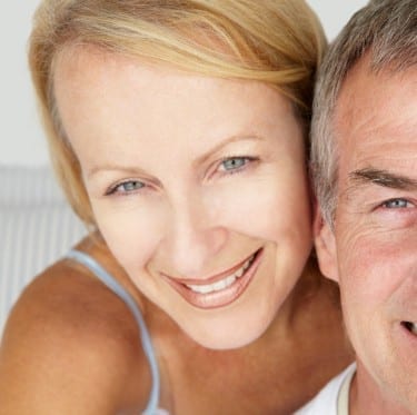 Headshot of middle aged couple